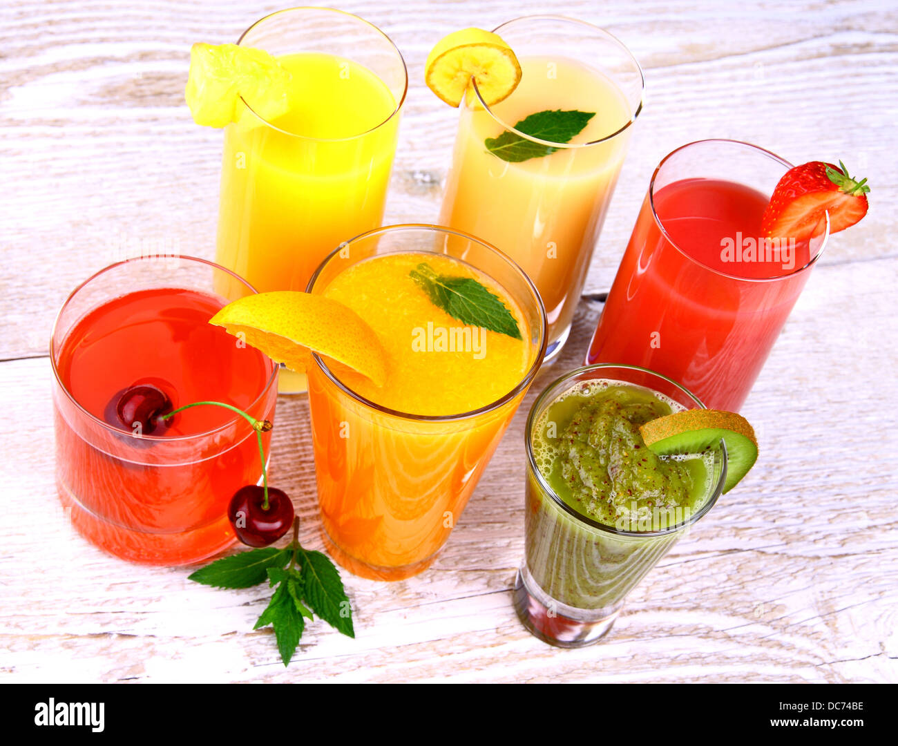 Fruit juices, kiwi, cherry, orange, strawberry, pineapple, top view