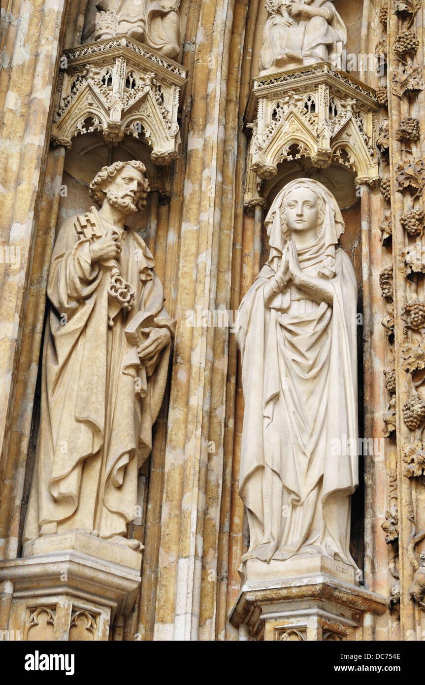 Medieval statues on entry in catholic church Petit Sablon in Brussels