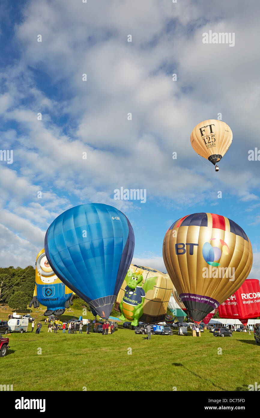 Bristol, UK. 9th Aug, 2013. Balloons at the 35th UK  Bristol balloon fiesta at the Ashton court estate Morning launch launch on the 9th August 2013 including the BT Ricoh Palletways an Despicable Me Stuart minion balloons and the Financial Times anniversary balloon taking off Credit:  David Lyon/Alamy Live News Stock Photo