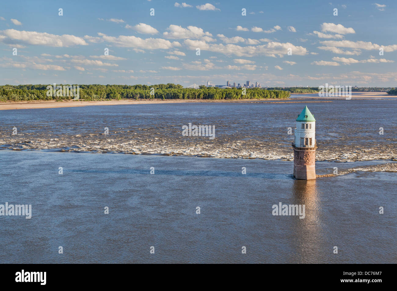 Mississippi RIver at Chain of Rocks with historical water intake tower and distant cityscape of St Louis Stock Photo