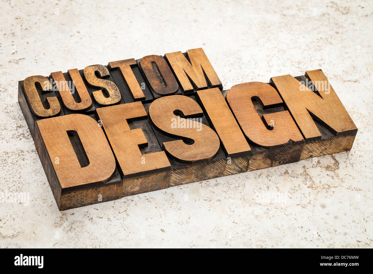 custom design text in vintage letterpress wood type on a ceramic tile background Stock Photo