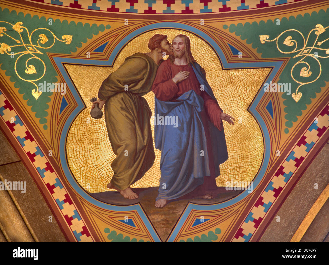 VIENNA - JULY 27: Fresco of Judas betray Jesus with the kiss scene in side nave of Altlerchenfelder church Stock Photo