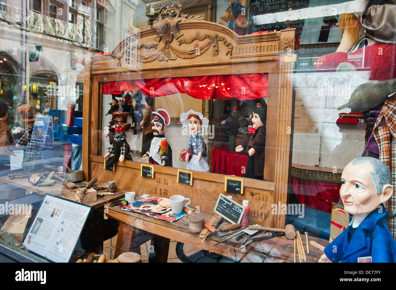 Showcase of antique store with dolls characters of the past centuries