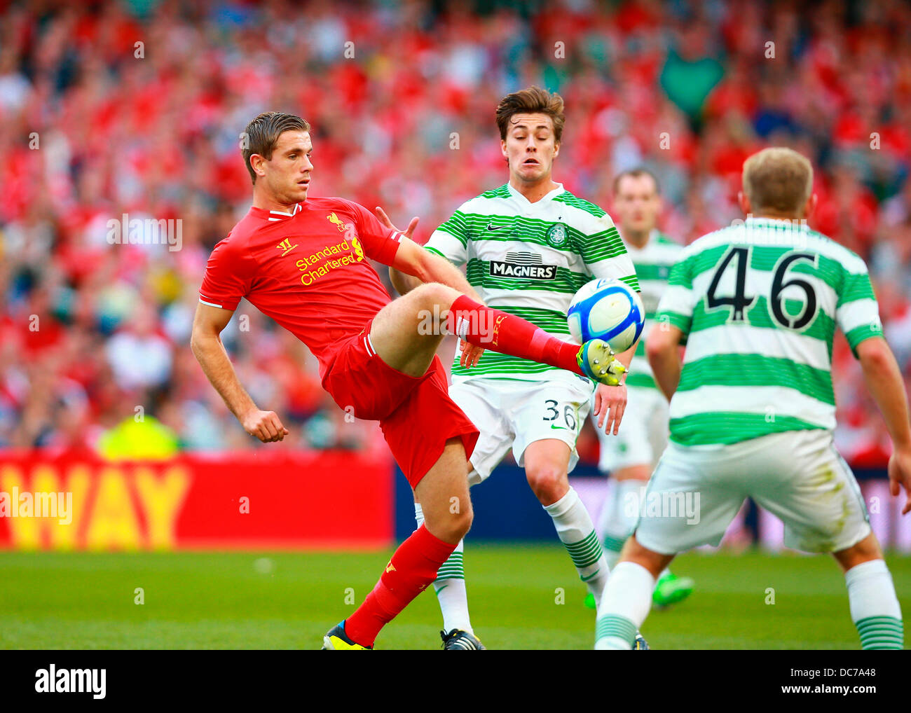 Dublin, Ireland. 10th Aug, 2013. Jordan Henderson (Liverpool) plays the ball under pressure from the Celtic defence during The Dublin Decider Football game between Liverpool FC and Glasgow Celtic from the Aviva Stadium. Credit:  Action Plus Sports/Alamy Live News Stock Photo