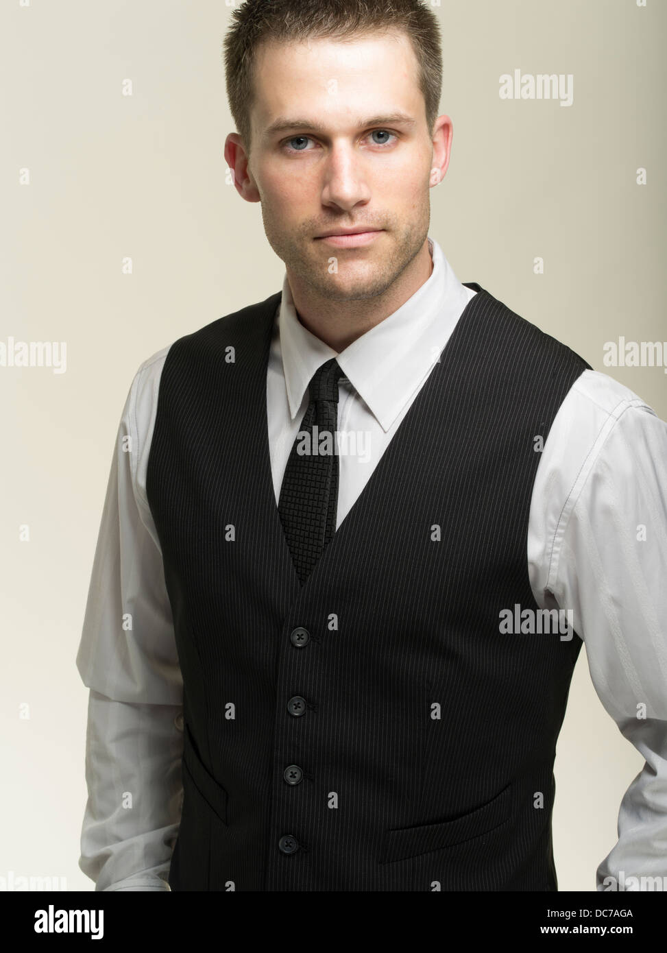 Young businessman white shirt, waistcoat and tie Stock Photo