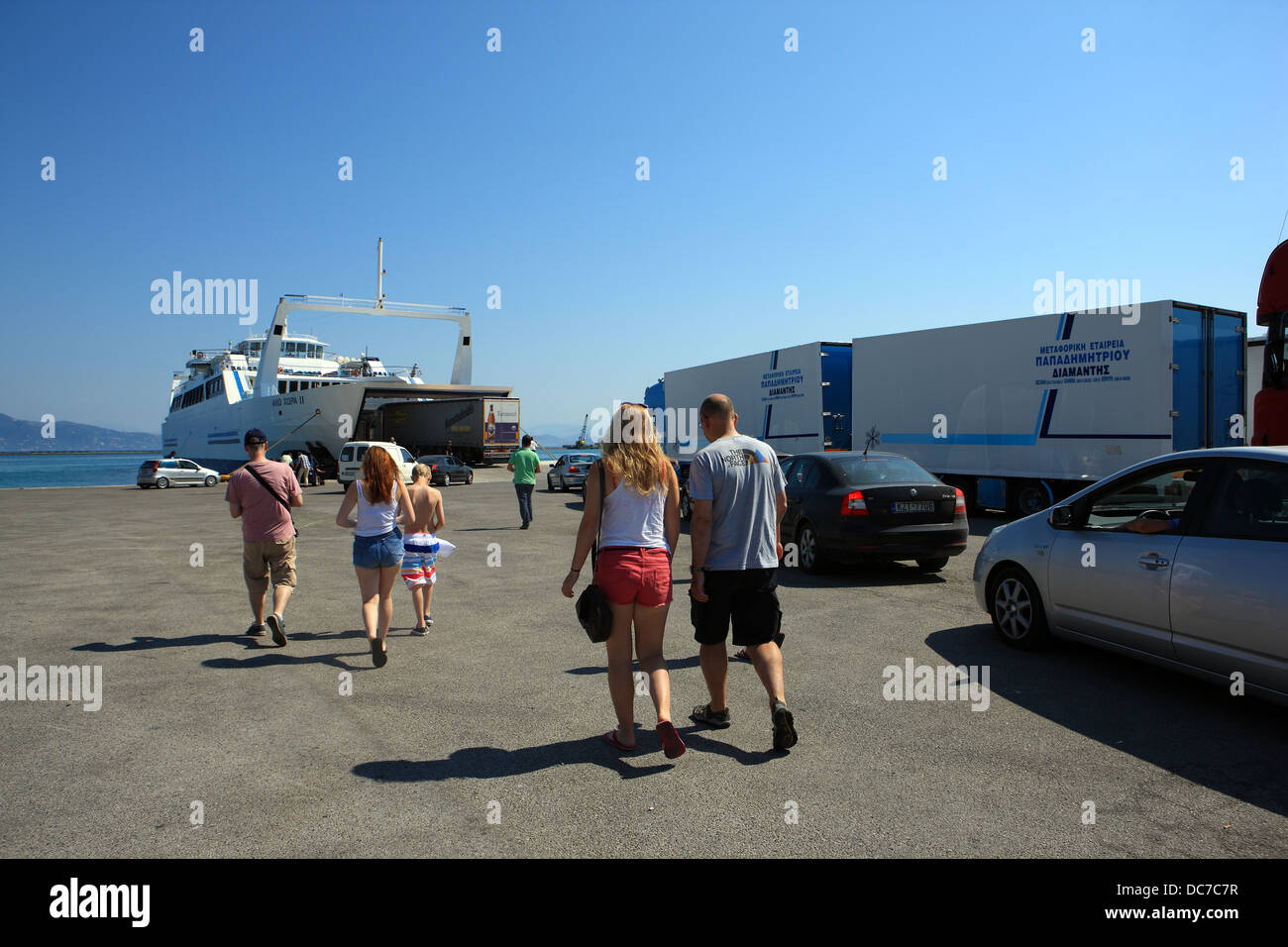 Passengers and cars about to board a ferry at the Ferry Port in Corfu, Greece Stock Photo