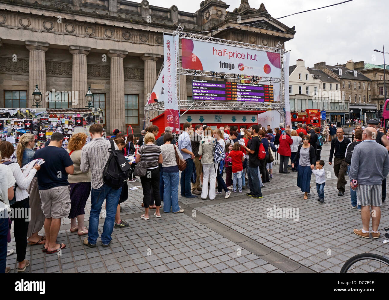 Eager Edinburgh Festival Fringe participants queuing at the Half-price Hut on the Mound by Princes Street in Edinburgh Stock Photo