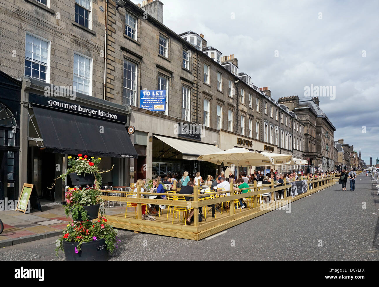 Outside eating and drinking facilities in George Street Edinburgh during the Edinburgh Festival in August 2013 Stock Photo