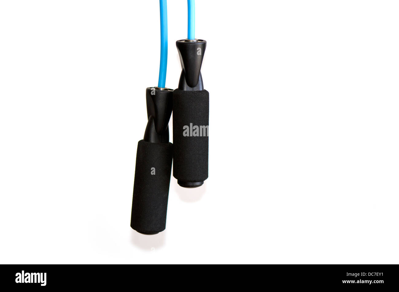 Jump rope hanging, for working out on white background. Stock Photo