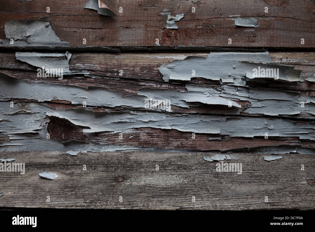 Flaking paint on rotting wooden planks Stock Photo