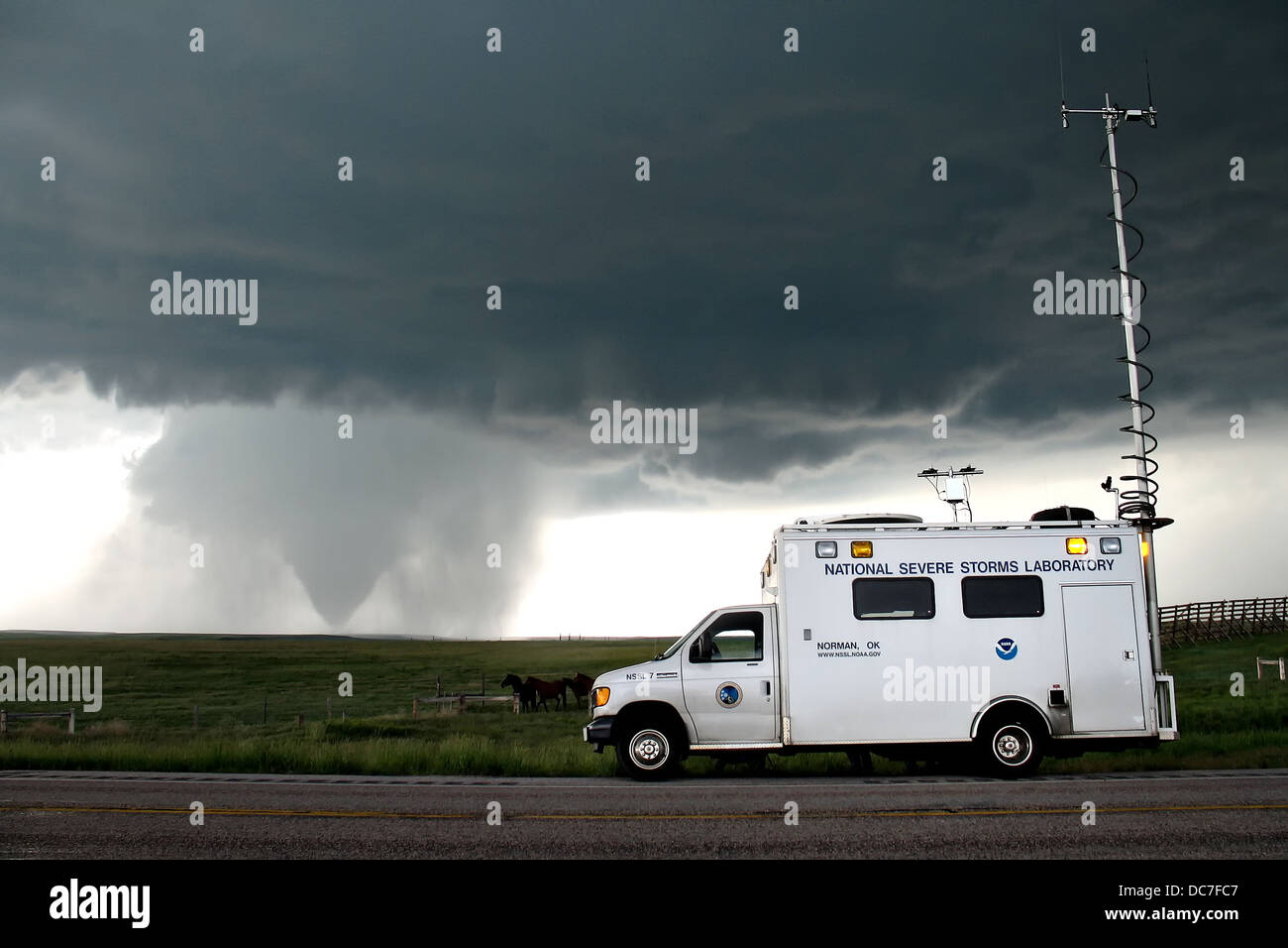 A VORTEX2 field command vehicle from the National Severe Storms Laboratory researches a tornado June 5, 2009 in LaGrange, Wyoming. Stock Photo