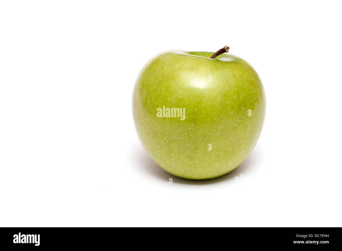 Single green Golden Delicious apple on a white background Stock Photo
