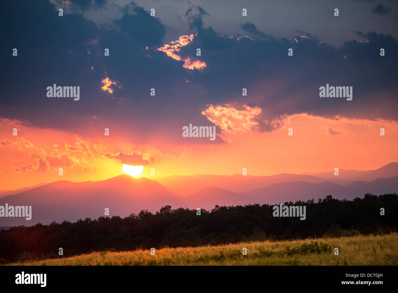 Dramatic sunset behind the Carpathian mountains Stock Photo