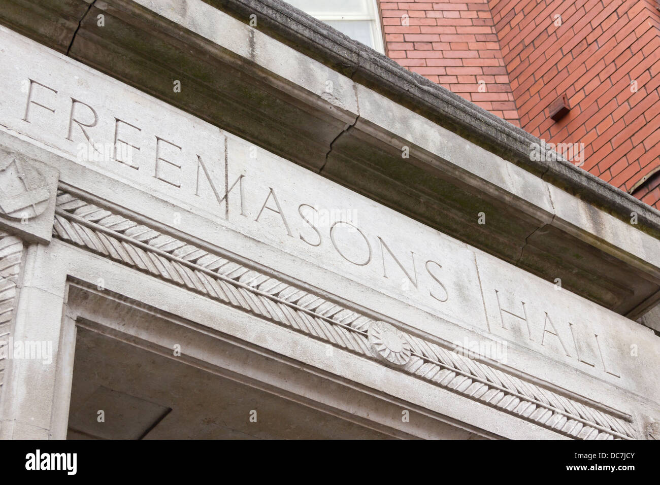 Engraved stone sign on lintel over the entrance to the Freemasons Hall ...