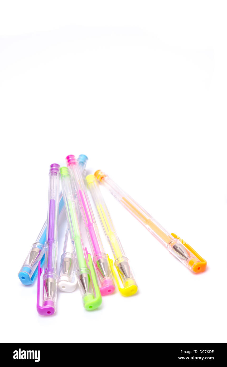 Close-up of colored fluorescent ball point pens on white background Stock Photo
