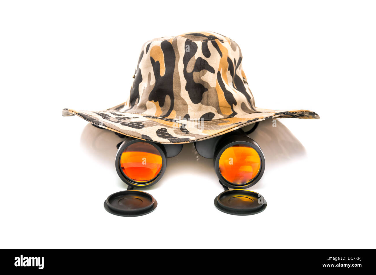 Binoculars and a safari hat on a white background conceptual of travel, adventure and eco-tourism or a wildlife safari Stock Photo