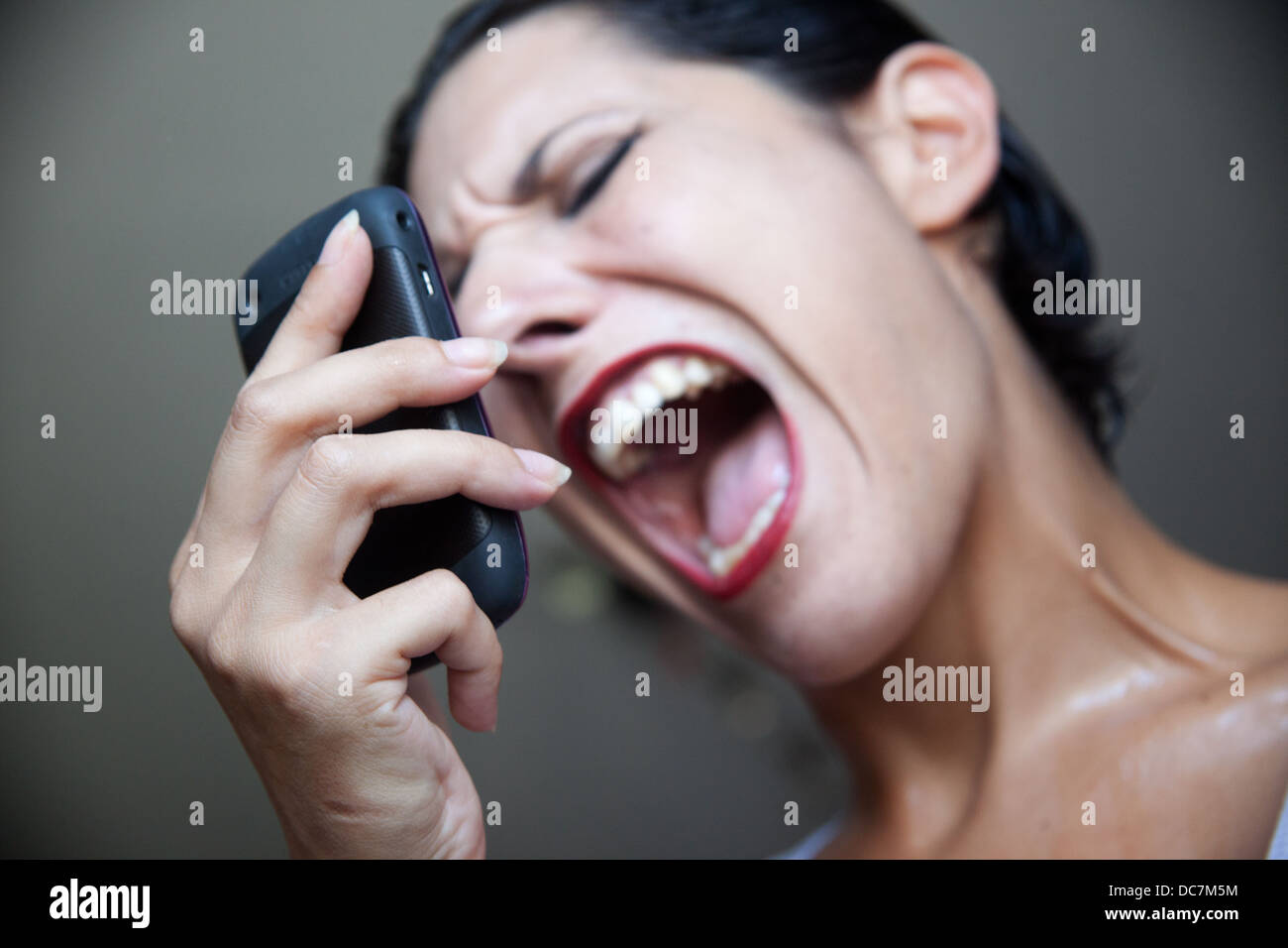 woman crying with phone Stock Photo