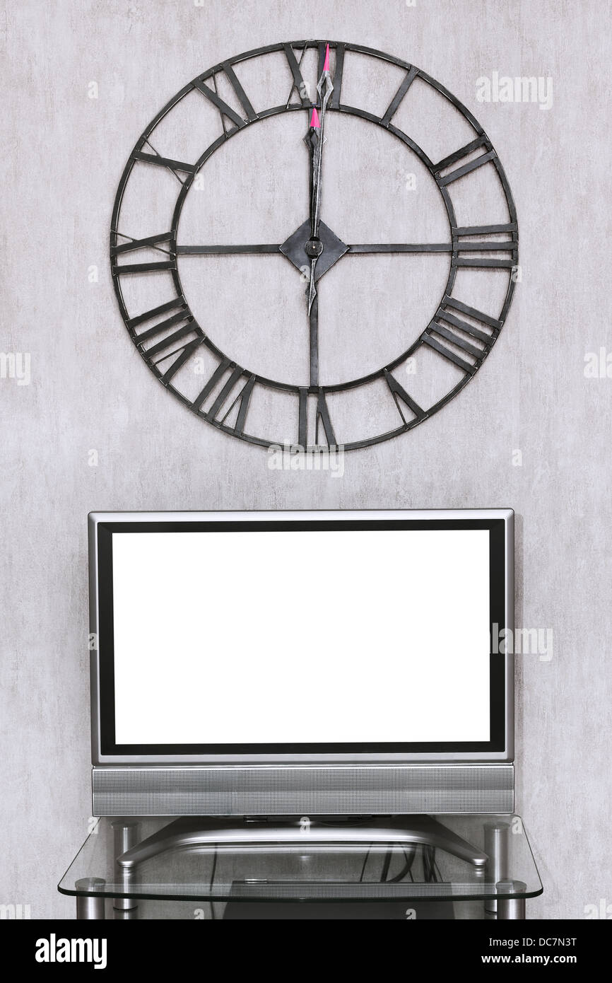mitnight time on wall clock under blank white screen of TV set Stock