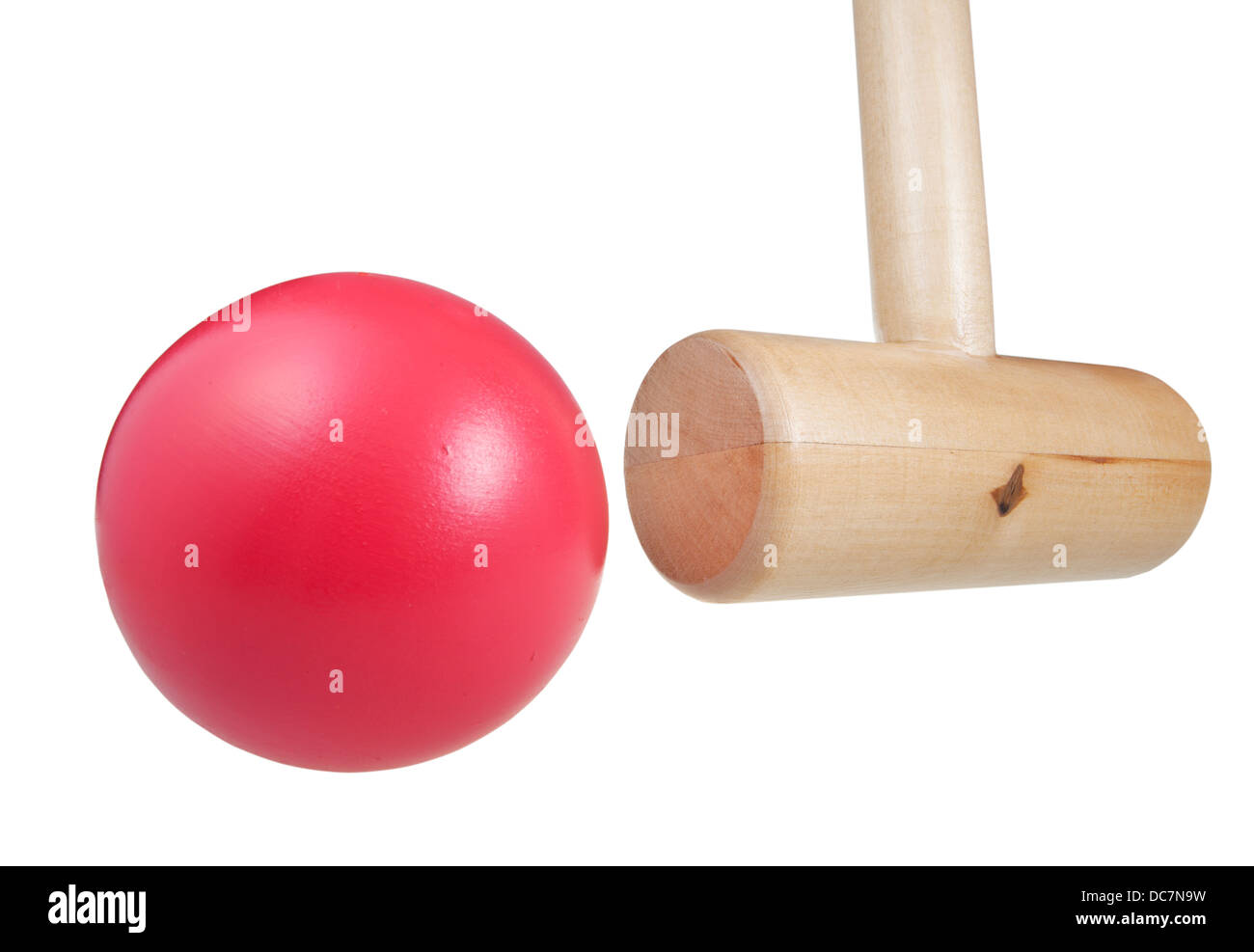 croquet mallet hits ball close up isolated on white background Stock
