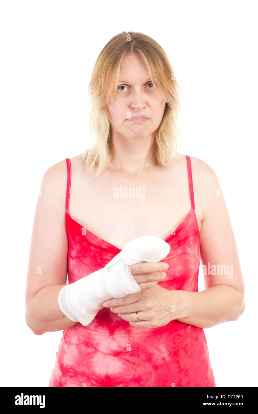 Sad caucasian woman with bandaged hand Stock Photo