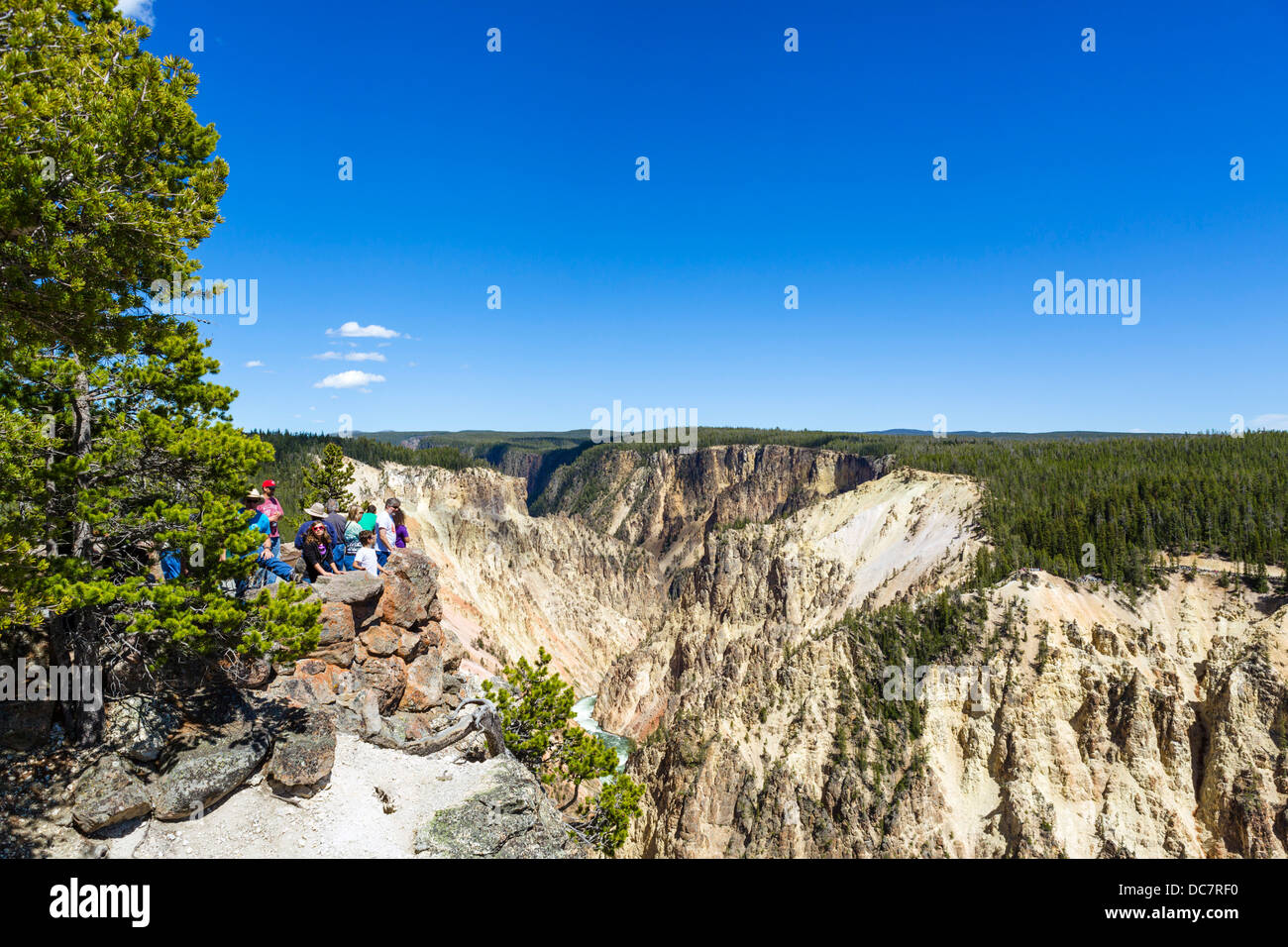 Tourists at Grand View on North Rim overlooking the Grand Canyon of the Yellowstone, Yellowstone National Park, Wyoming, USA Stock Photo