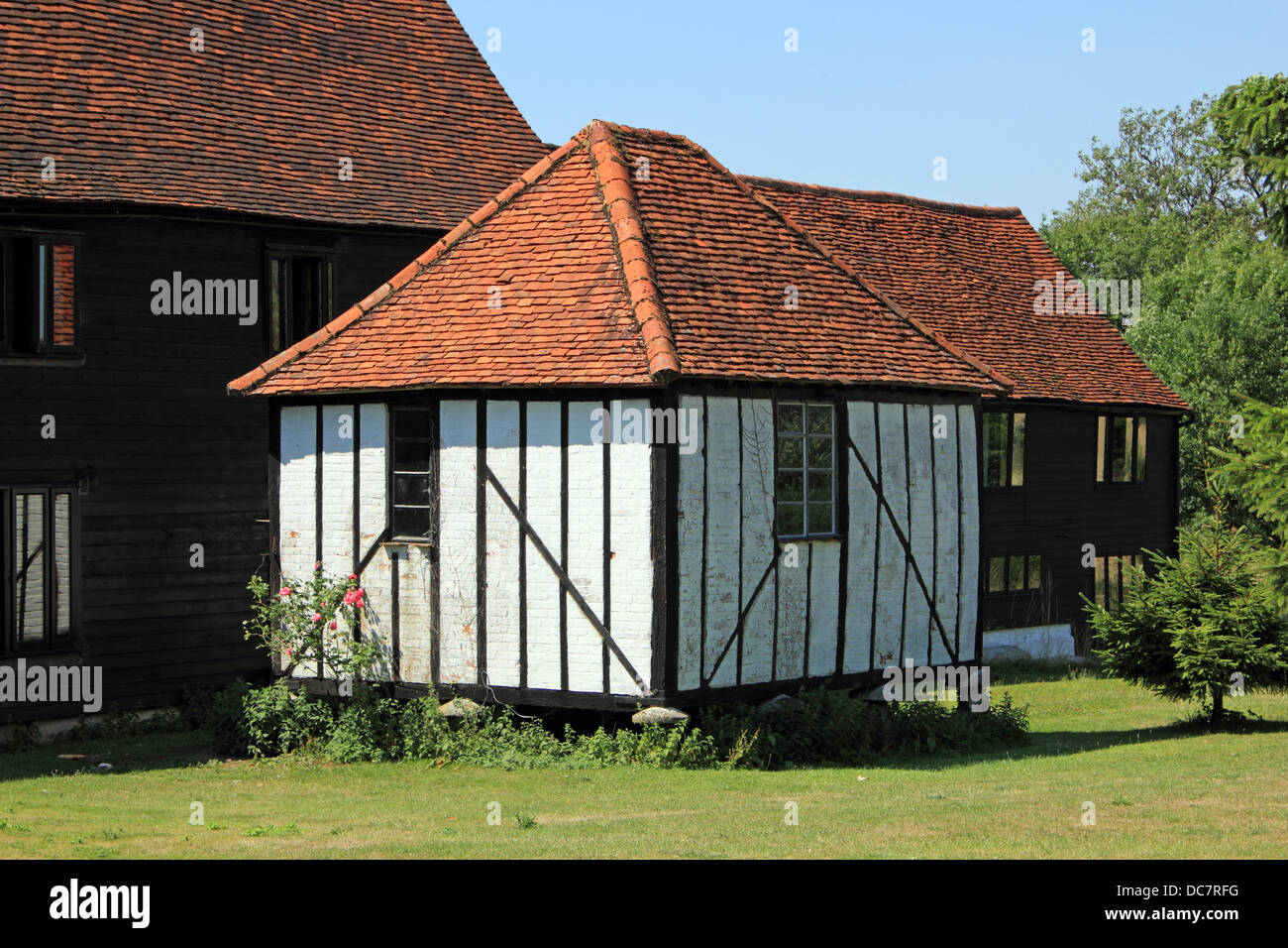 Traditional old barn raised above the ground on staddle stones, to protect the contents from vermin. Hertfordshire, England UK. Stock Photo