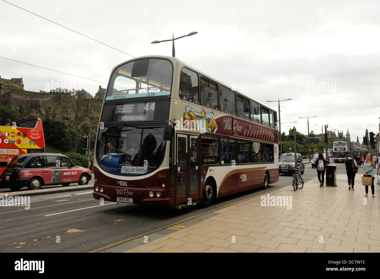 Lothian Buses, Edinburgh. The double decker bus pictured here on Princes Street Edinburgh where tram lines have been layed: Stock Photo