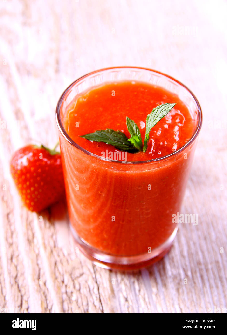 Strawberry smoothie in glass with berrie and mint, soft focus Stock Photo