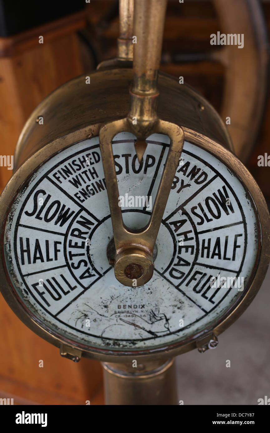 A nautical instrument pointed to the word 'stop.' Stock Photo