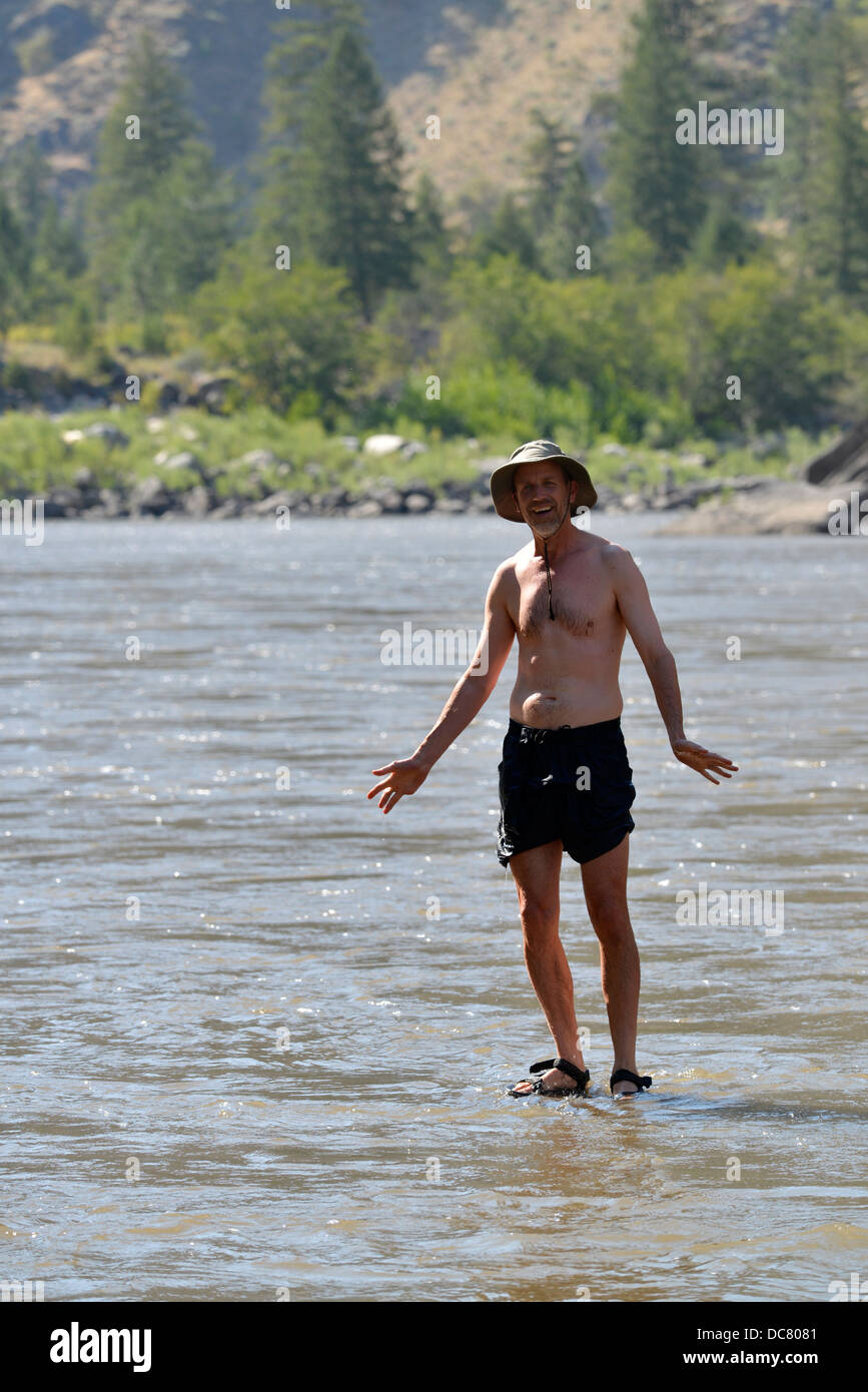Standing on a rock in Idaho's Salmon River. Stock Photo