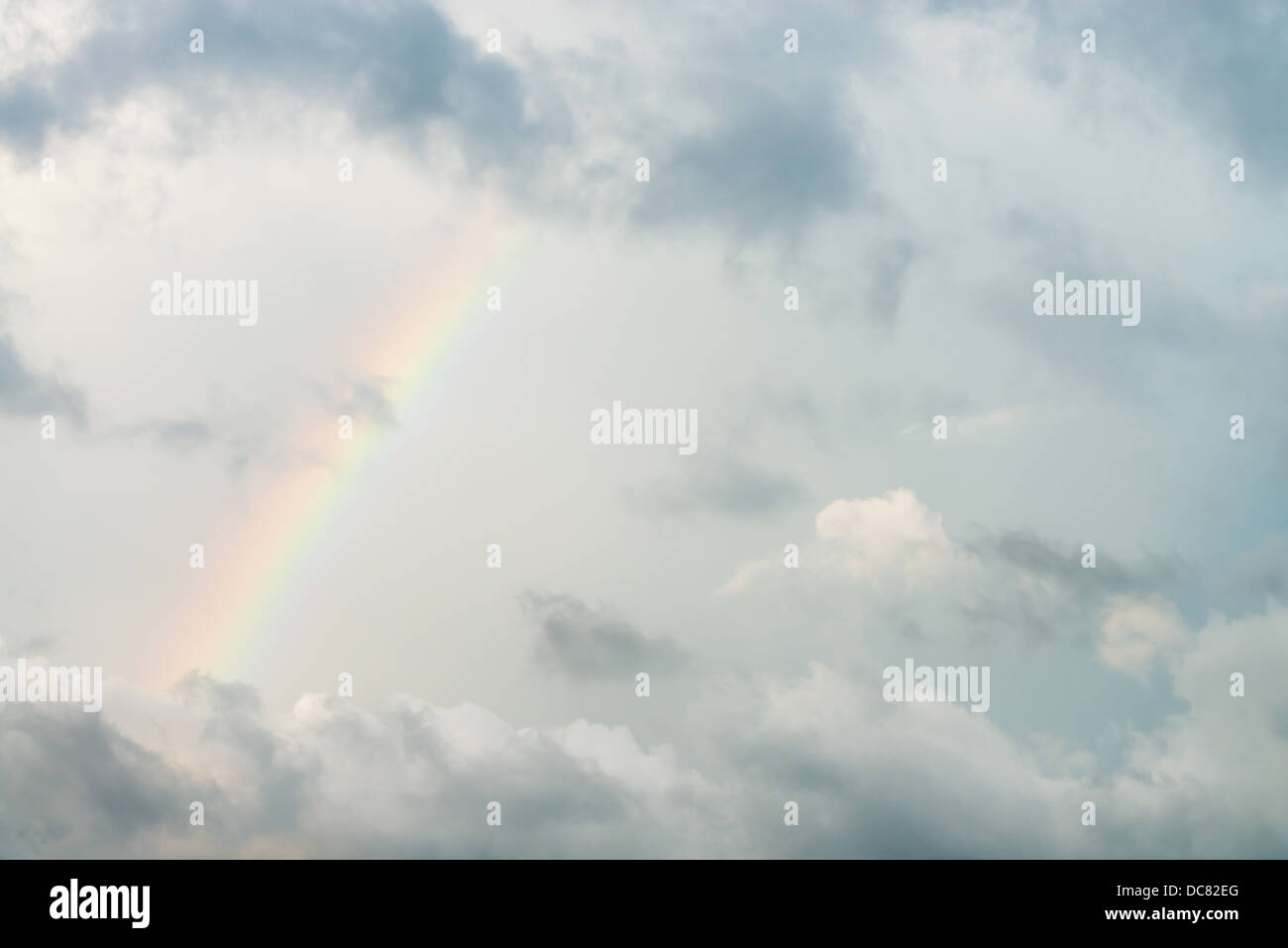 Dark cloudy sky with rainbow after rain storm Stock Photo - Alamy