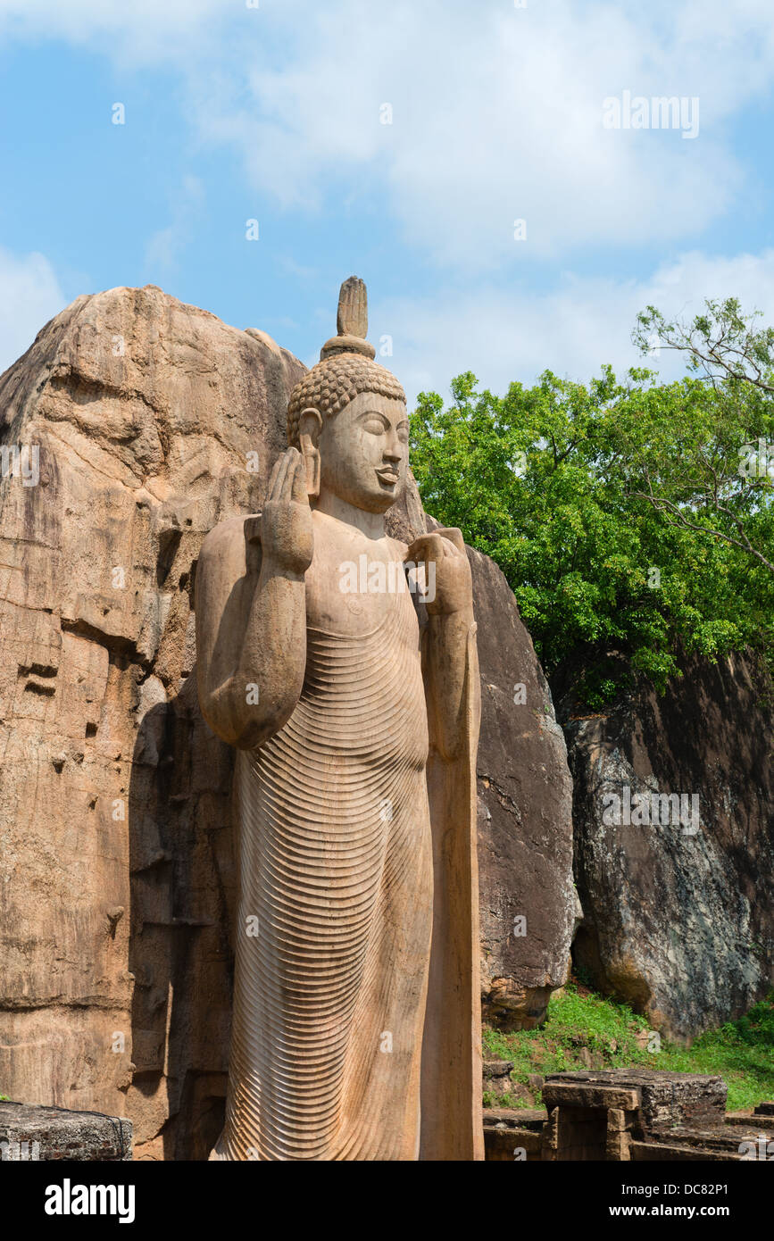 Avukana standing Buddha statue, Sri Lanka. 40 feet (12 m) high, has been  carved out of a large granite rock in the 5th century Stock Photo - Alamy