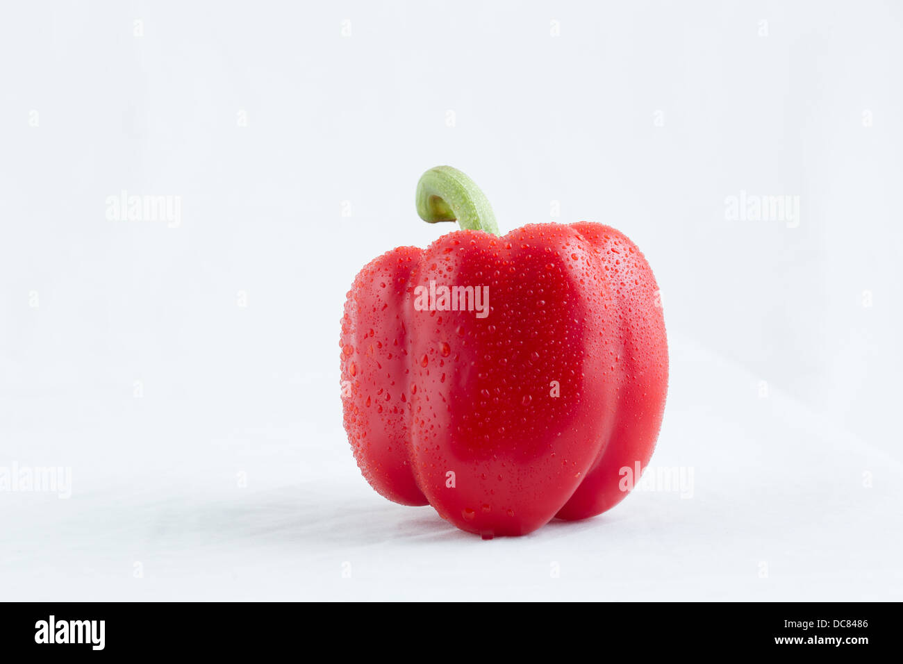 Red Bell Pepper on a table Stock Photo - Alamy