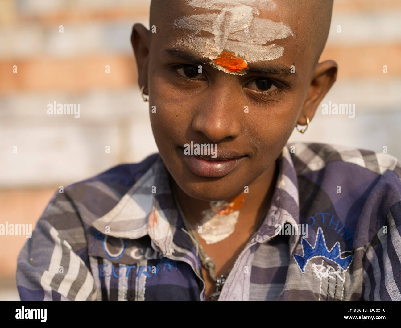 Portrait of young Saivite pilgrim who had  traveled to the Ganges River ( Varanasi ) for Kumbh Mela in March 2013. Stock Photo