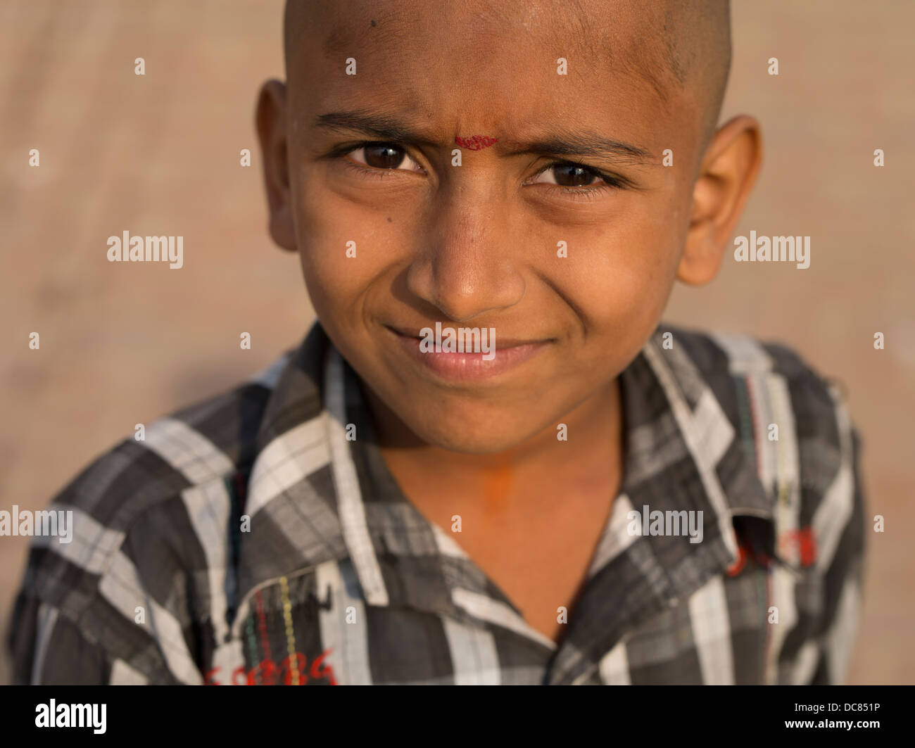 Portrait of young pilgrim who had  traveled to the Ganges River ( Varanasi ) for Kumbh Mela in March 2013. Stock Photo