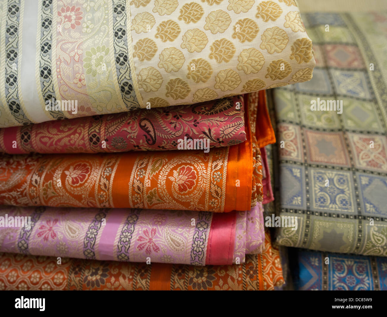 Saris, pashminas, shawls and scarfs made of silk, cashmere, and wool on sale in Varanasi India Stock Photo