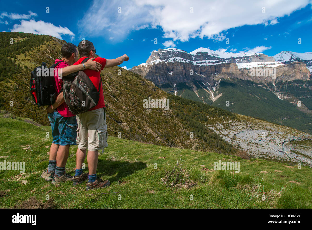 Caucasian male hikers watching the panorama in Ordesa and Mount Perdido National Park, Huesca, Aragon, Spain Stock Photo