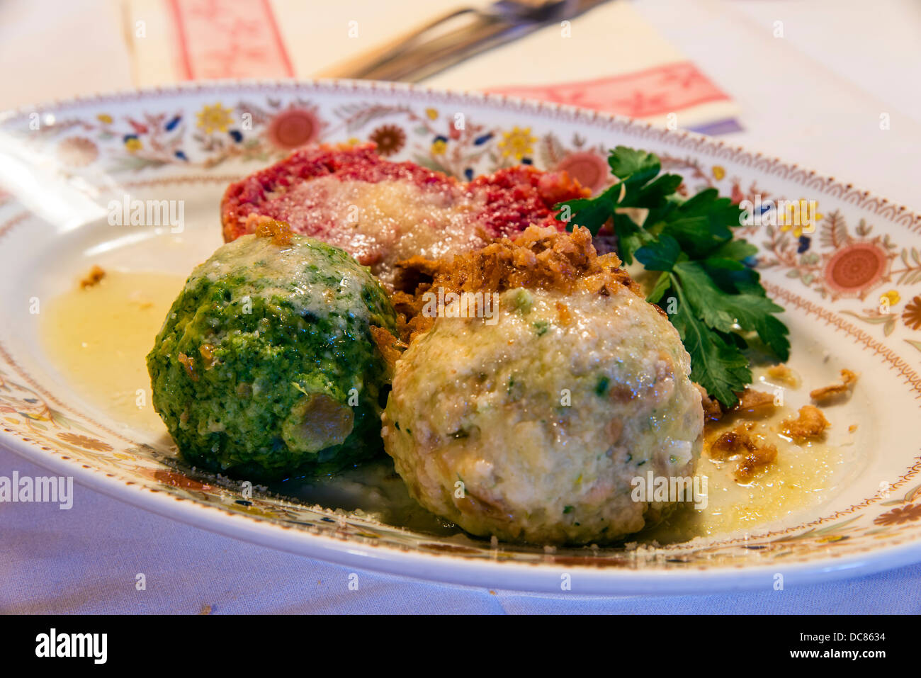 Knödel or Canederli bread dumplings, a typical speciality of Alto Adige or South Tyrol, Italy Stock Photo