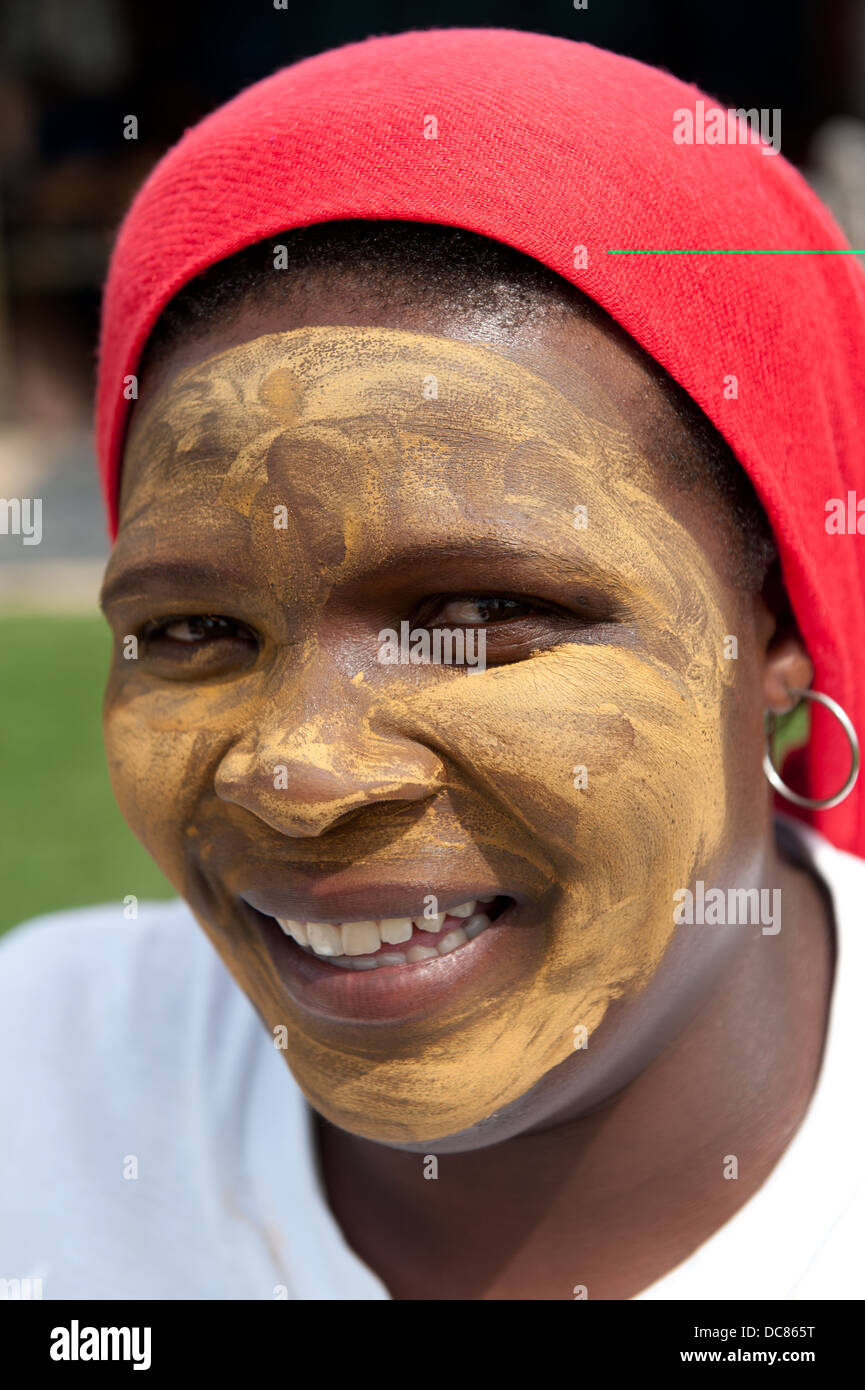 Xhosa woman with face mask, Knysna, Western Cape, South Africa Stock Photo