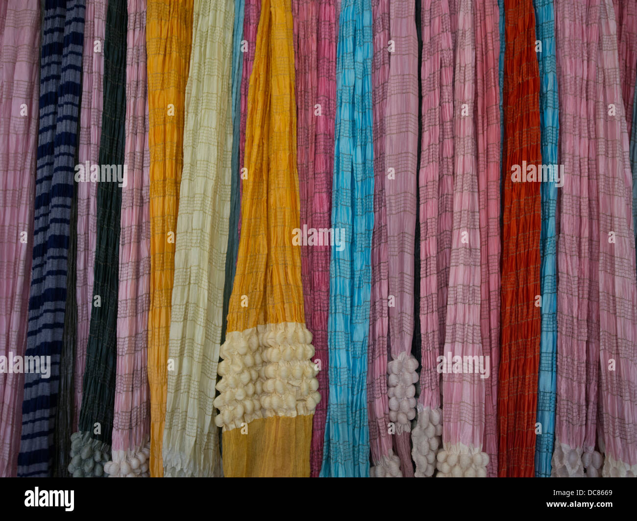 Saris, pashminas, shawls and scarfs made of silk, cashmere, and wool on sale in Varanasi India Stock Photo