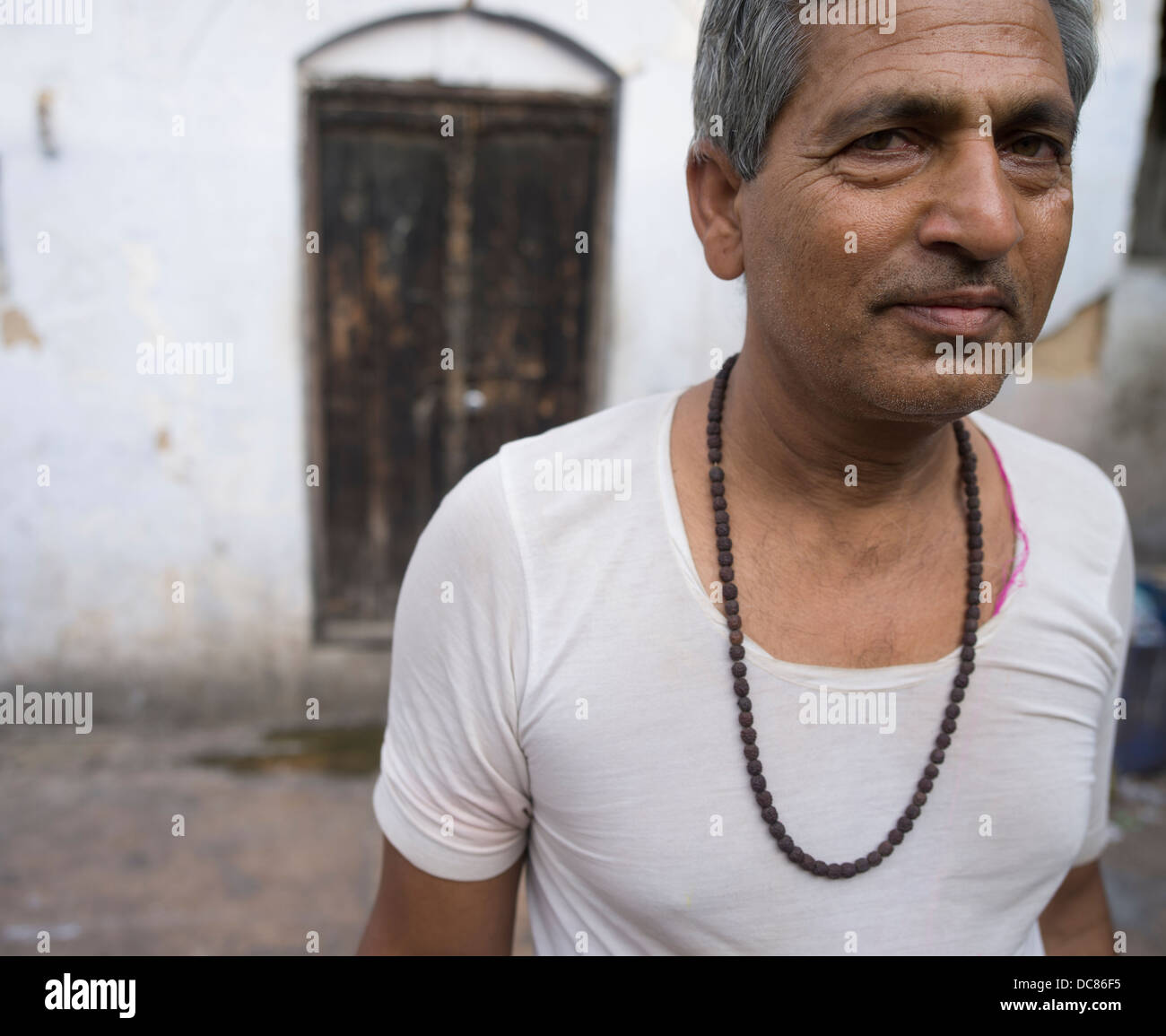 Portrait of pilgrim who had  traveled to the Ganges River ( Varanasi ) for Kumbh Mela in March 2013. Stock Photo
