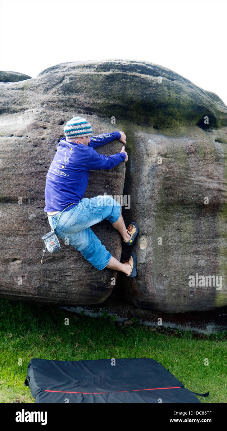 rock climber bouldering at Burbage Edge South, Derbyshire, Peak District National Park, England, UK, United, Kingdom Stock Photo