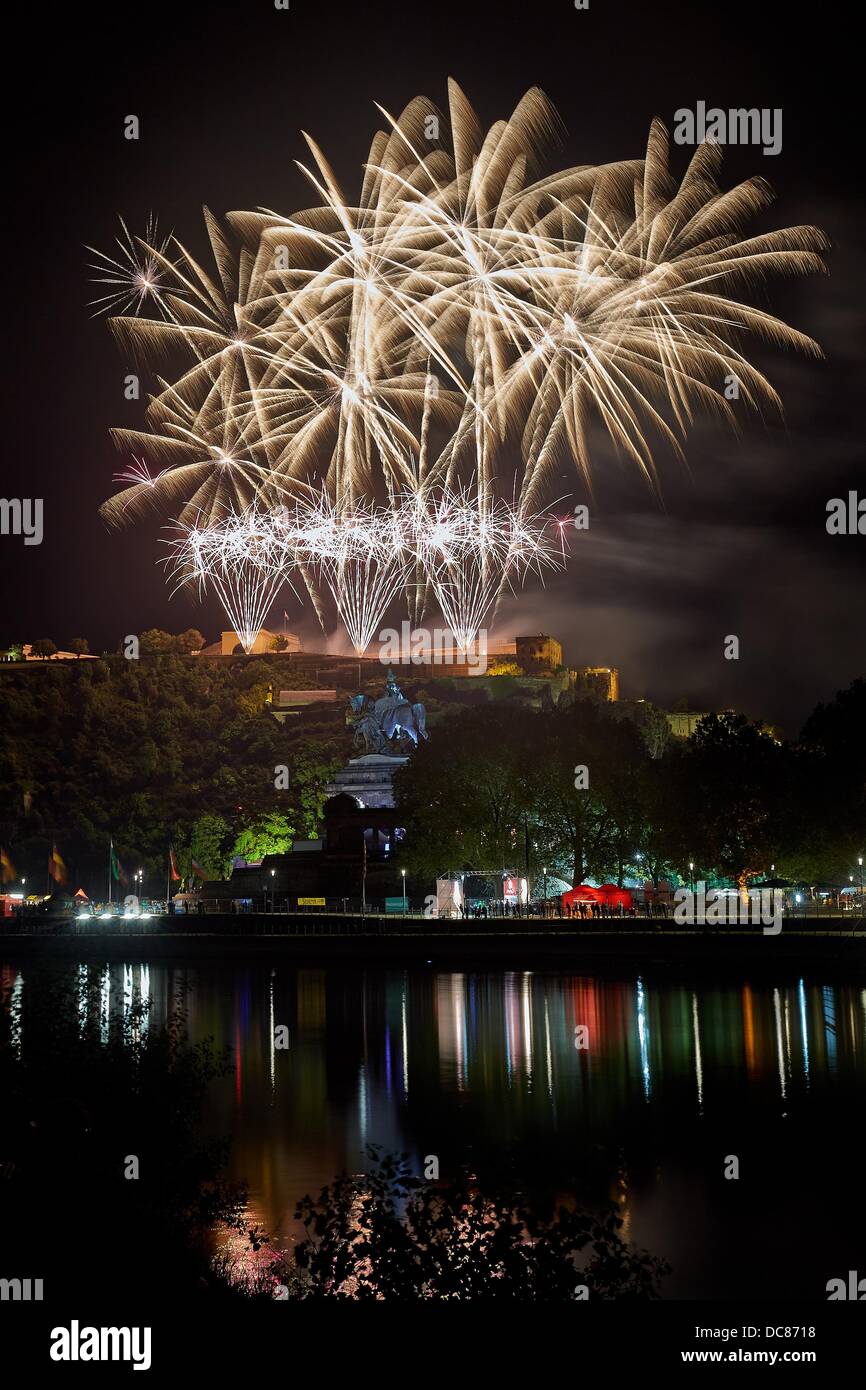 The final fireworks of the event 'Rhein in Flammen' (lit. 'Rhine in flames') is seen from the Ehrenbreitstein castle in Koblenz, Germany, 10 August 2013. In the foreground the German Corner ('Deutsches Eck') with the statue of the German Emperor William I is seen. Photo: Thomas Frey Stock Photo