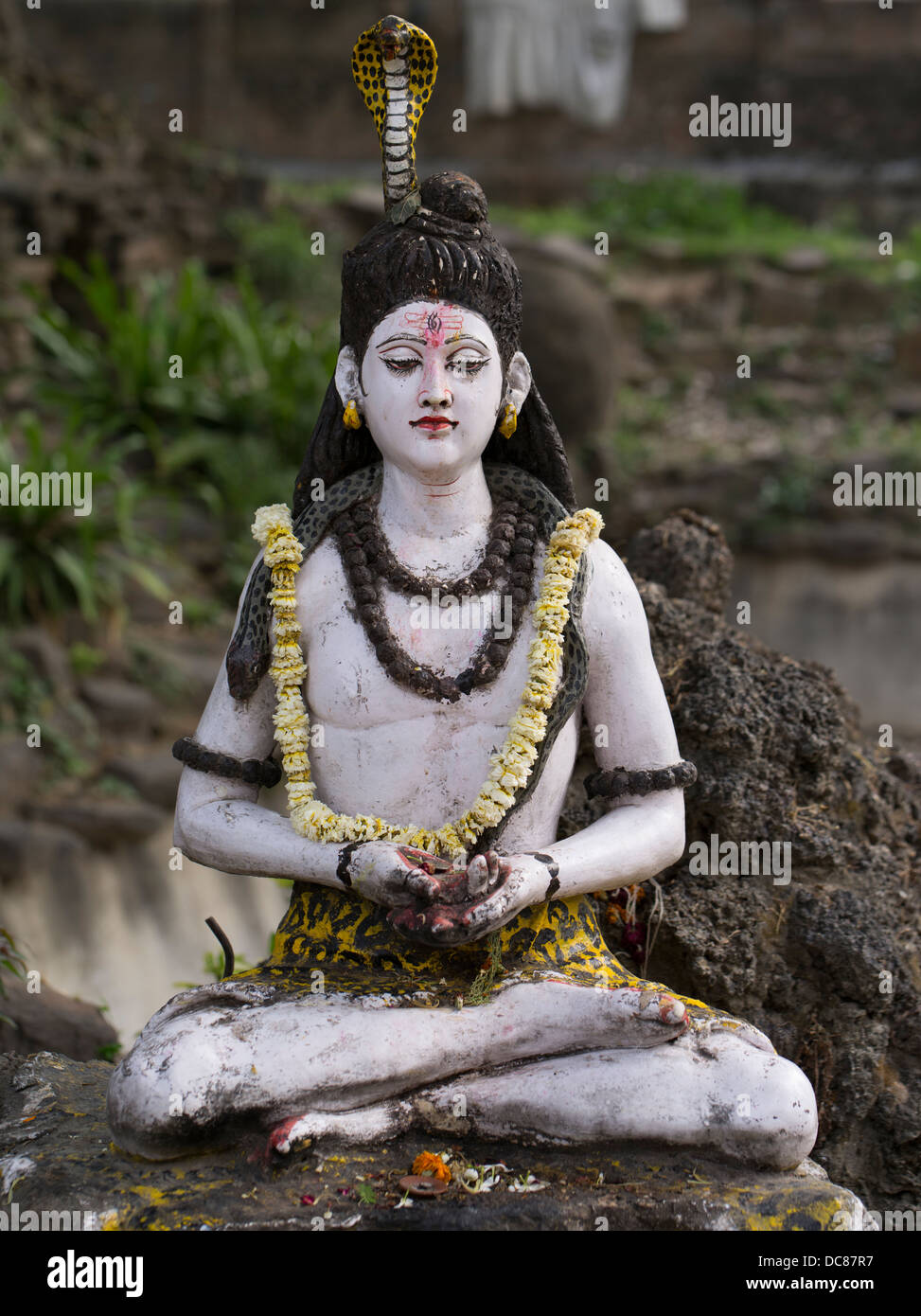 Statue of Lord Shiva, Hindu Deity - Life on the banks of the Ganges River - Varanasi, India Stock Photo