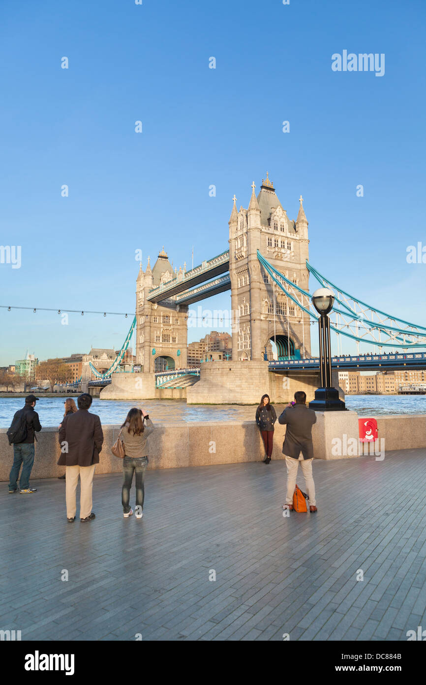 Tourists taking a picture at Tower bridge, London, England Stock Photo