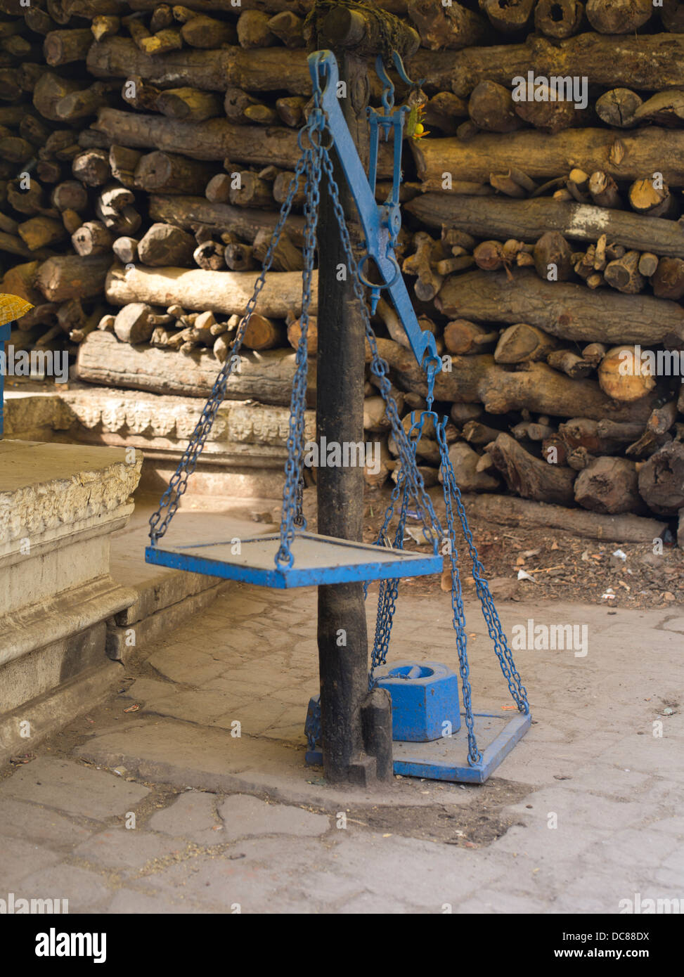 Manikarnika Ghat. Wood for cremations and scales on the banks of the Ganges River - Varanasi, India Stock Photo