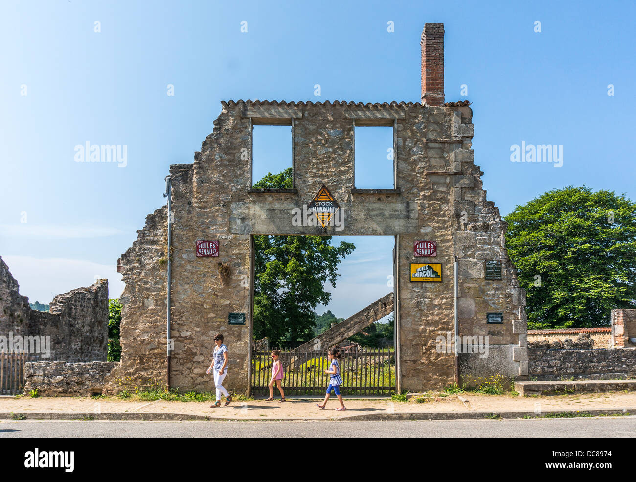 The Poutaraud Garage, with signs still intact, at Oradour-sur-Glane, war-massacre village, Haute-Vienne department, Limousin, west-central France. Stock Photo