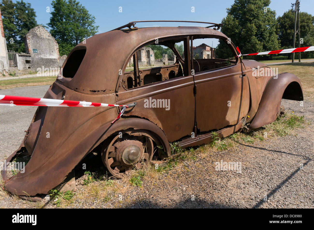 The iconic, often-photographed, left-to-rust 'Doctor's Car' at Oradour-sur-Glane village, Haute-Vienne department, Limousin, west-central France. Stock Photo