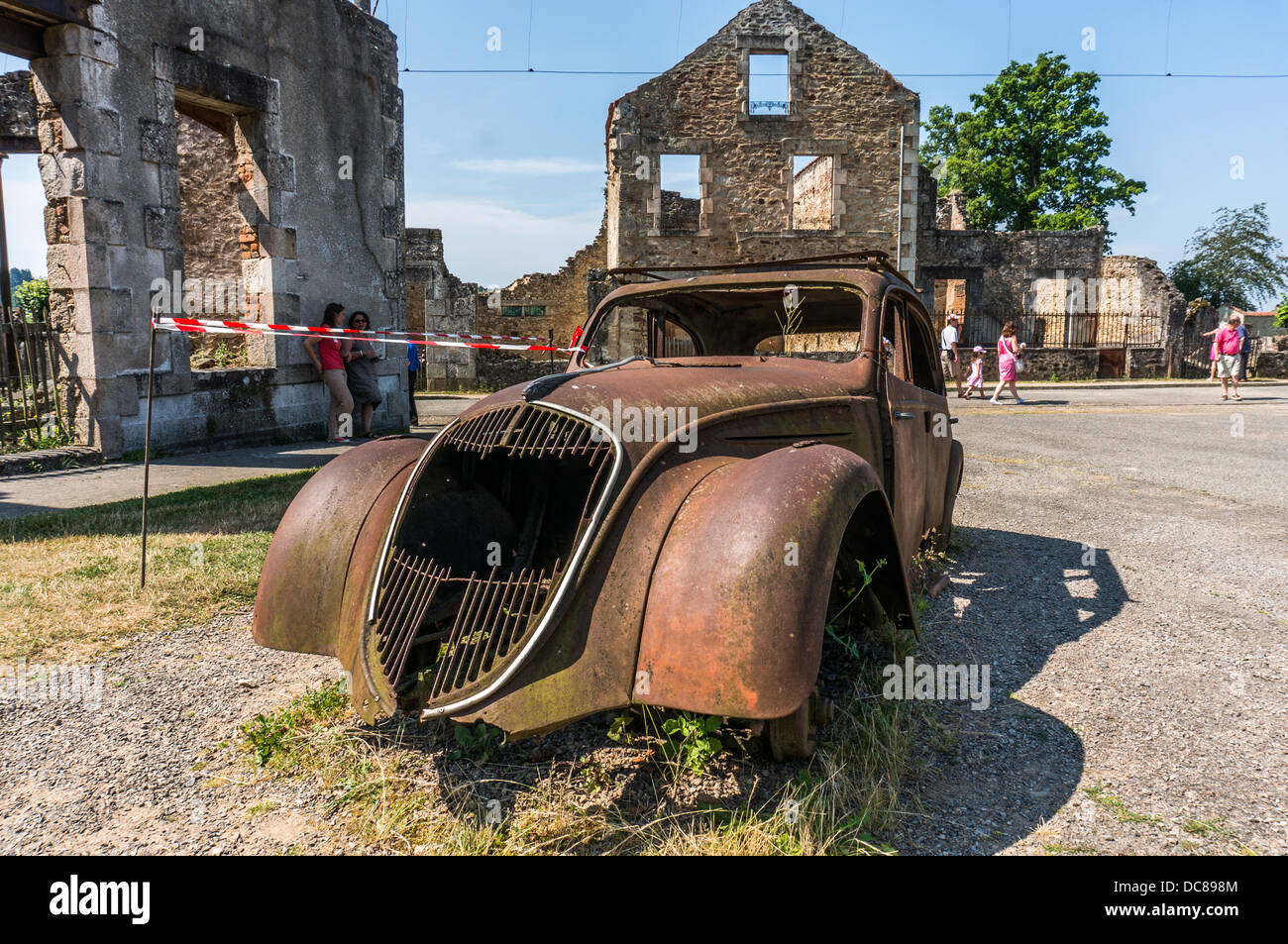 The iconic, often-photographed, left-to-rust 'Doctor's Car' at Oradour-sur-Glane village, Haute-Vienne department, Limousin, west-central France. Stock Photo