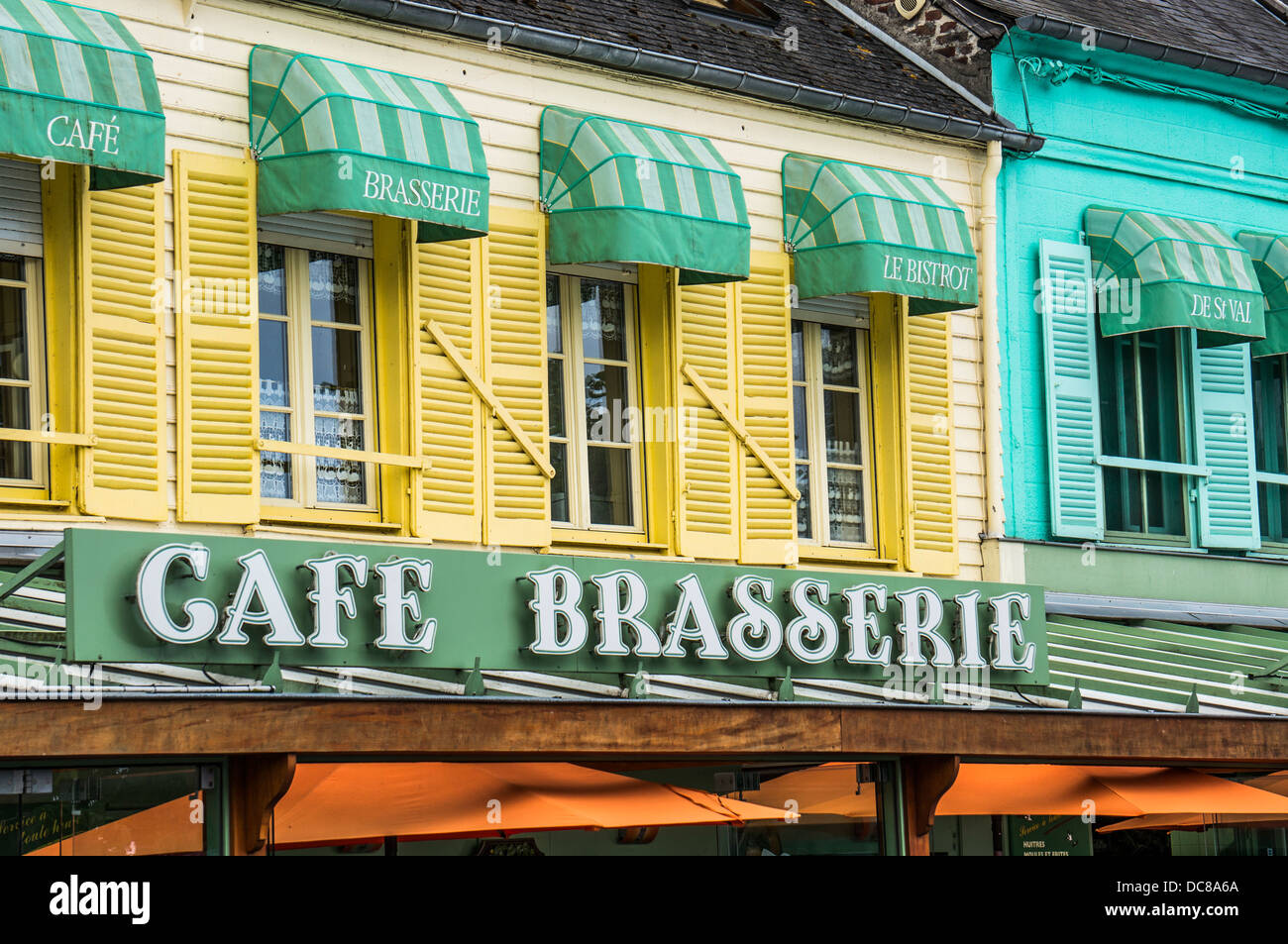 Colourful Windows And Shutters Above The Cafe Brasserie In Stock